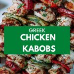 four skewers of greek chicken kebabs on a white platter on a wooden table.