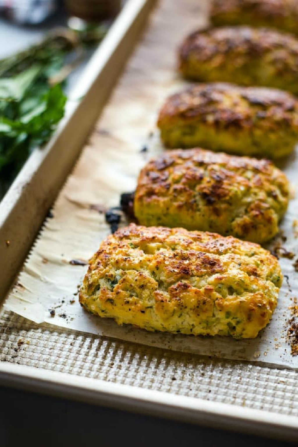 ricotta herb savory scones on a baking sheet lined with parchment paper.