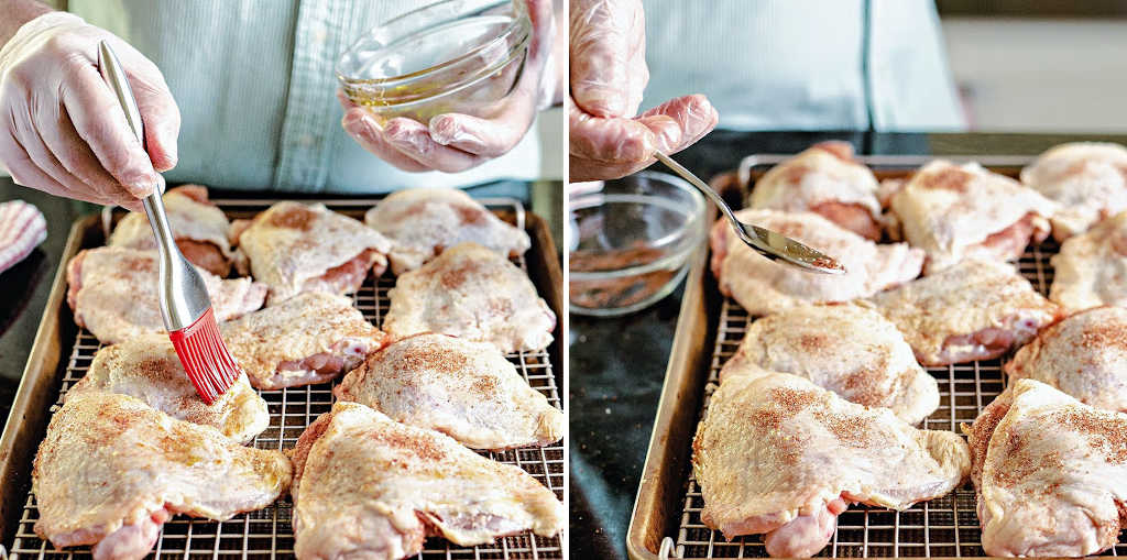 Process steps for prepping chicken thighs for the smoker: brush with olive oil, lightly sprinkle with spice on top of the skin.