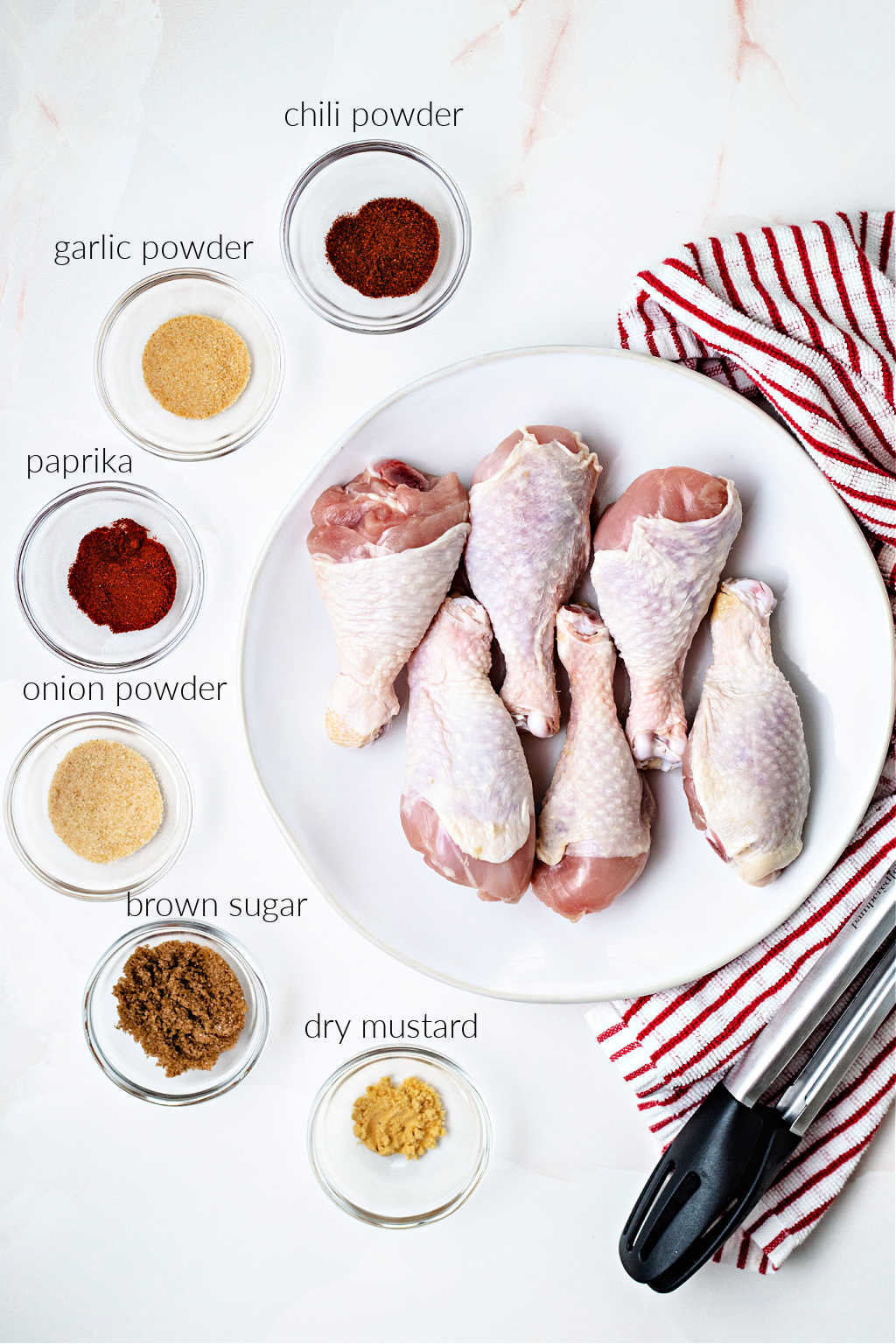 ingredients for air fryer chicken legs on a table.
