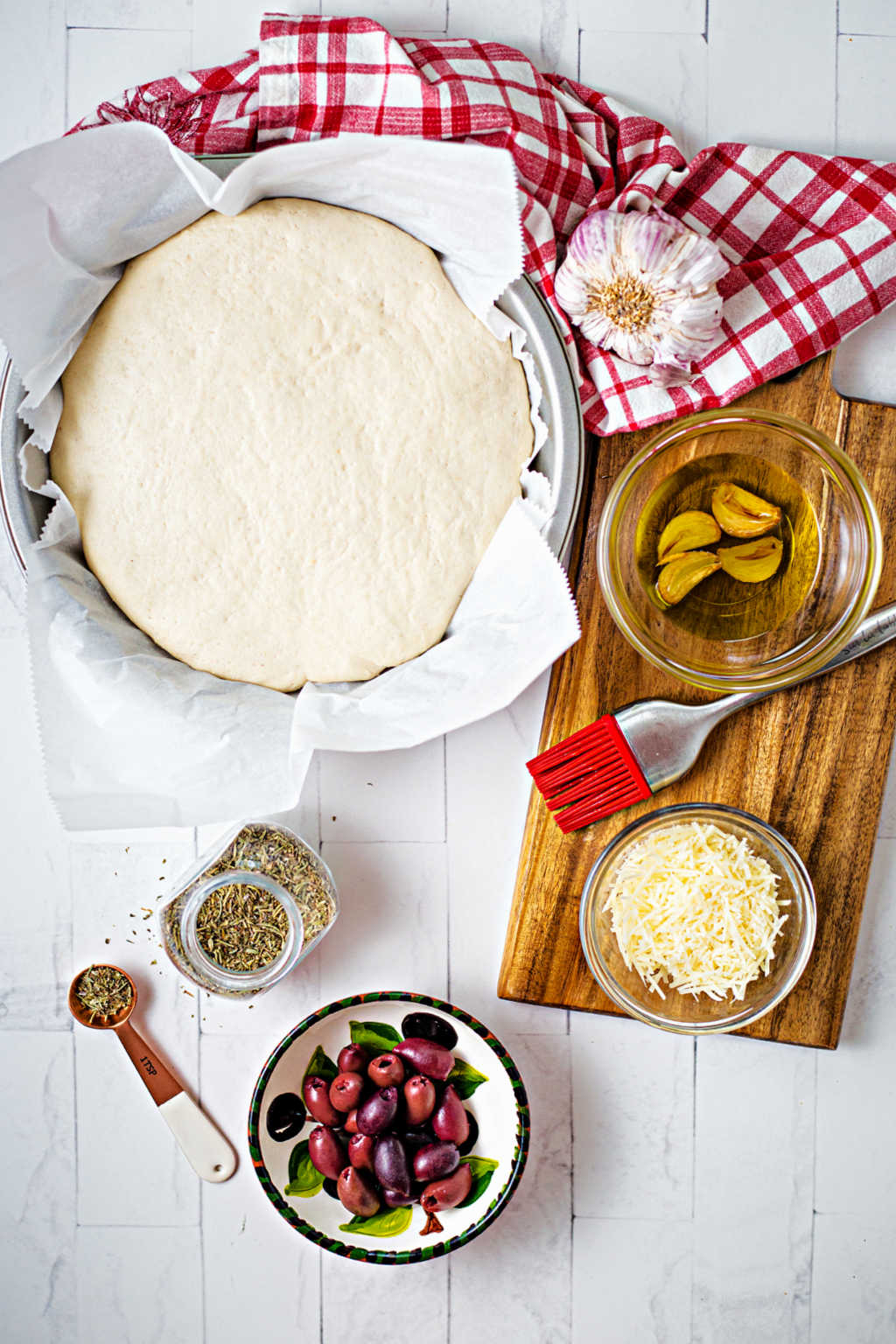 ingredients for greek olive focaccia bread on a counter