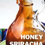 honey sriracha sauce in a glass decanter.