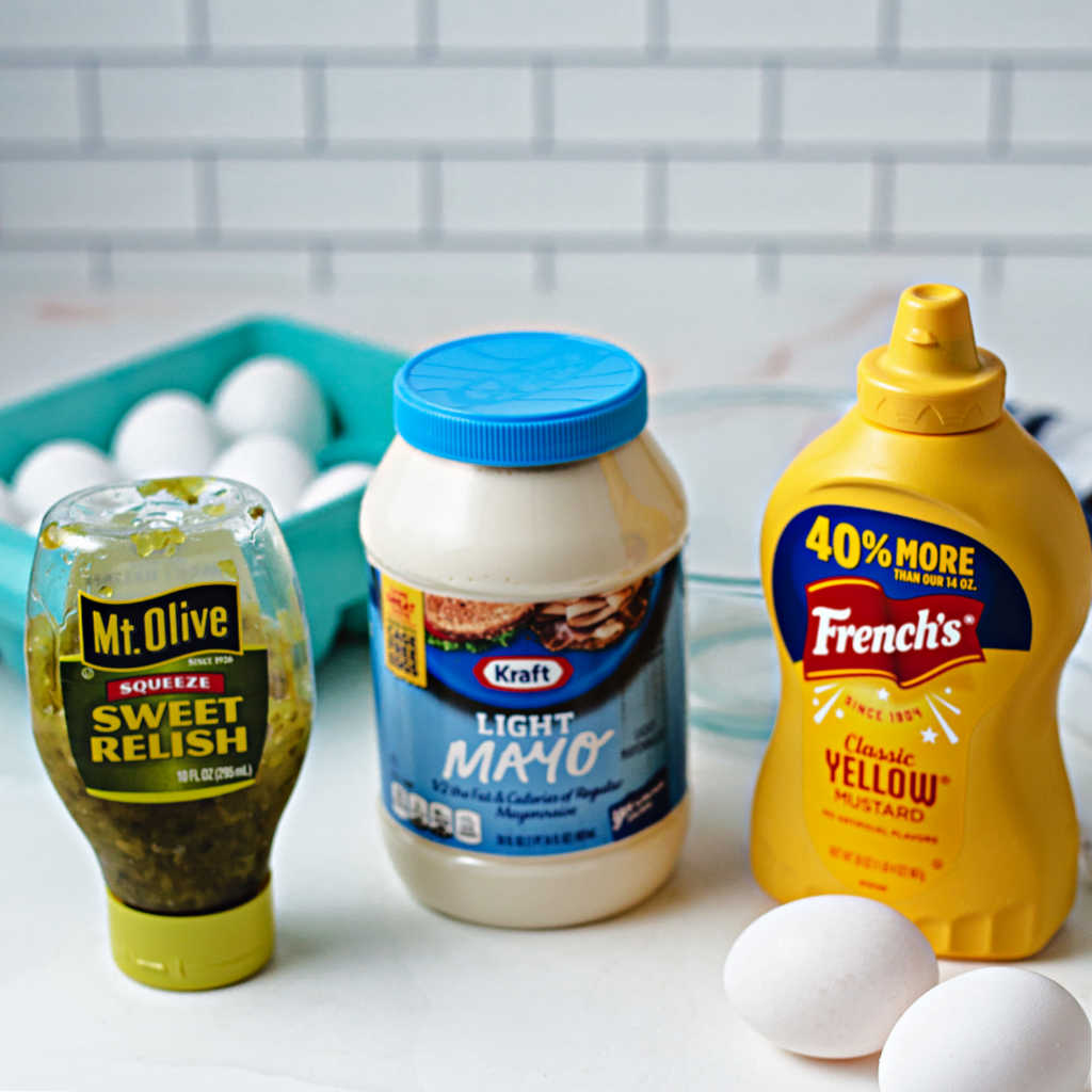 ingredients for making the filling for southern deviled eggs on a kitchen counter.