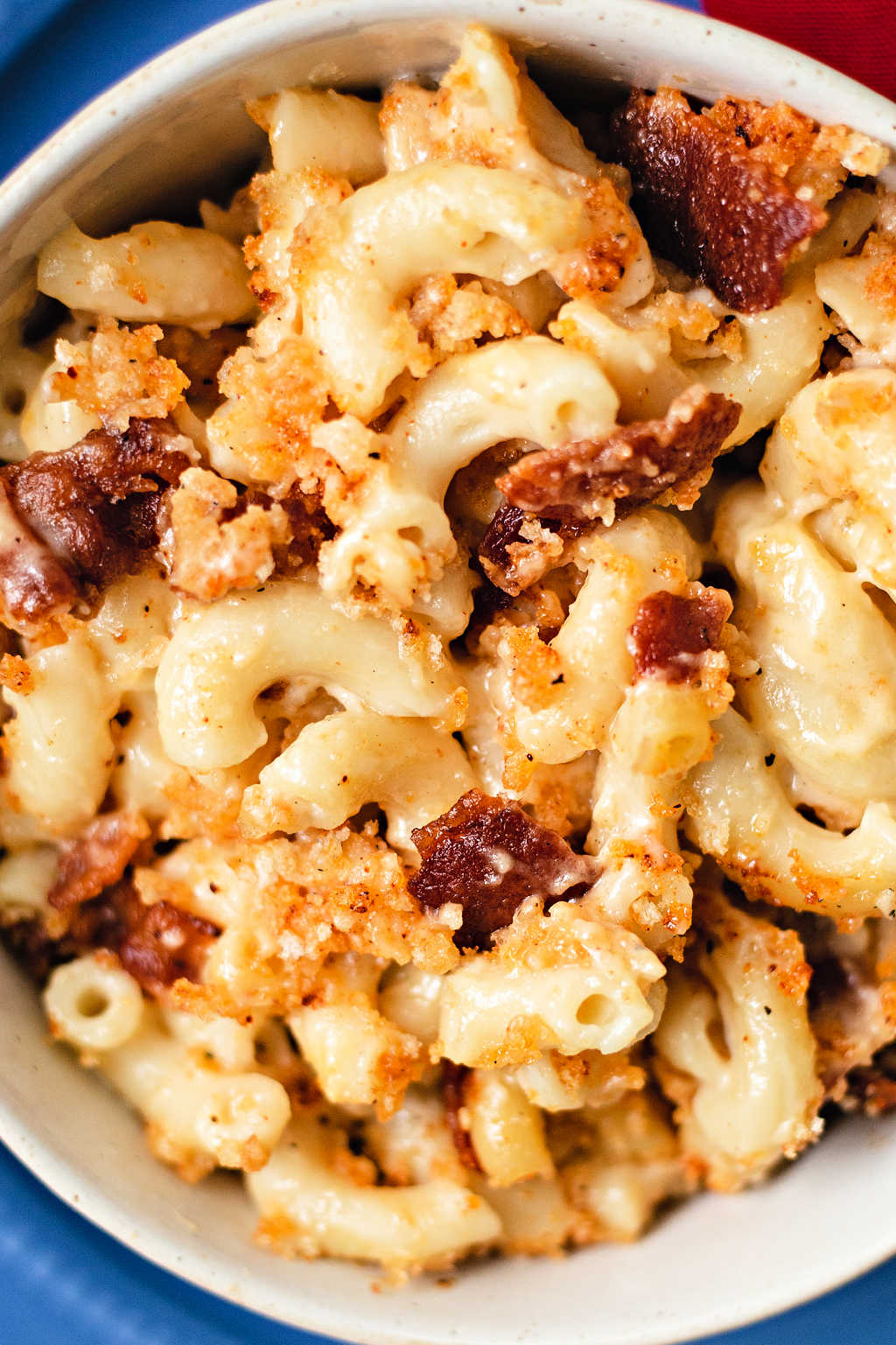 close up shot of smoked mac and cheese with bits of bacon.