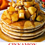 CINNAMON PANCAKES WITH APPLE COMPOTE ON A WHITE PLATE IN FRONT OF A FALL TABLESCAPE.
