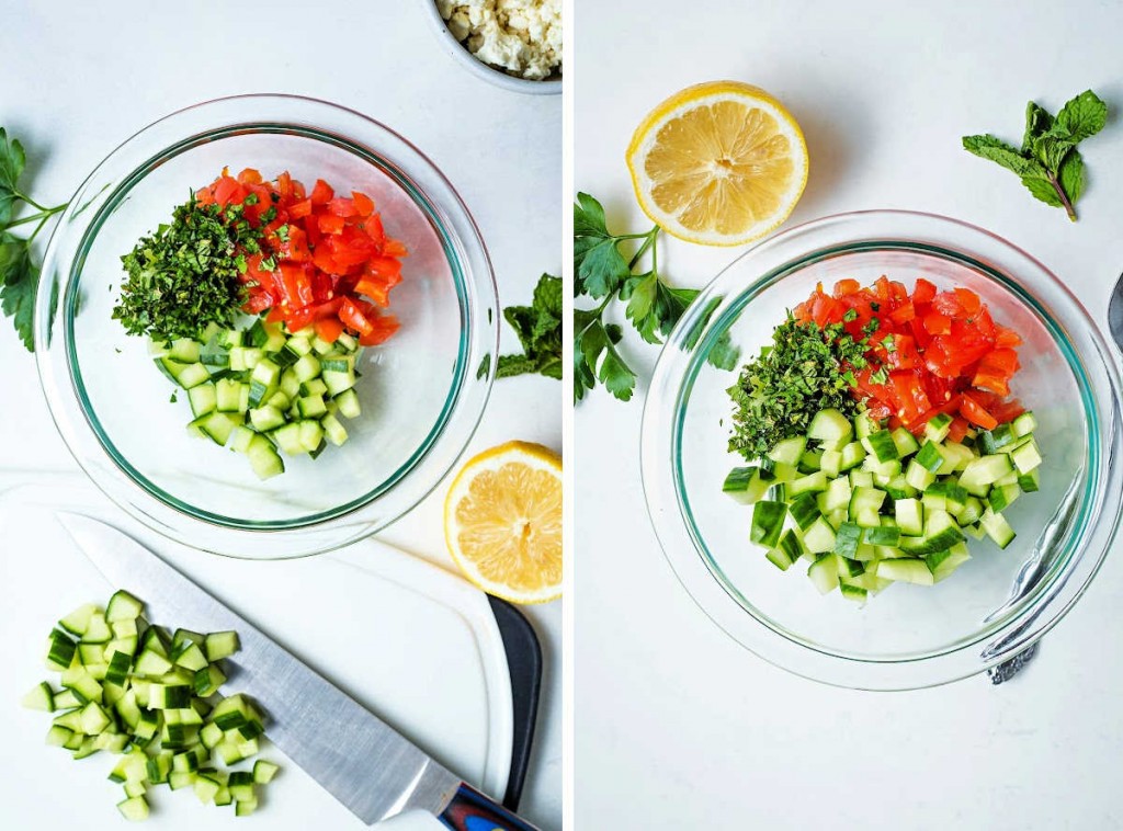 a bowl of chopped cucumber, tomato, and herbs on a table with a lemon half.