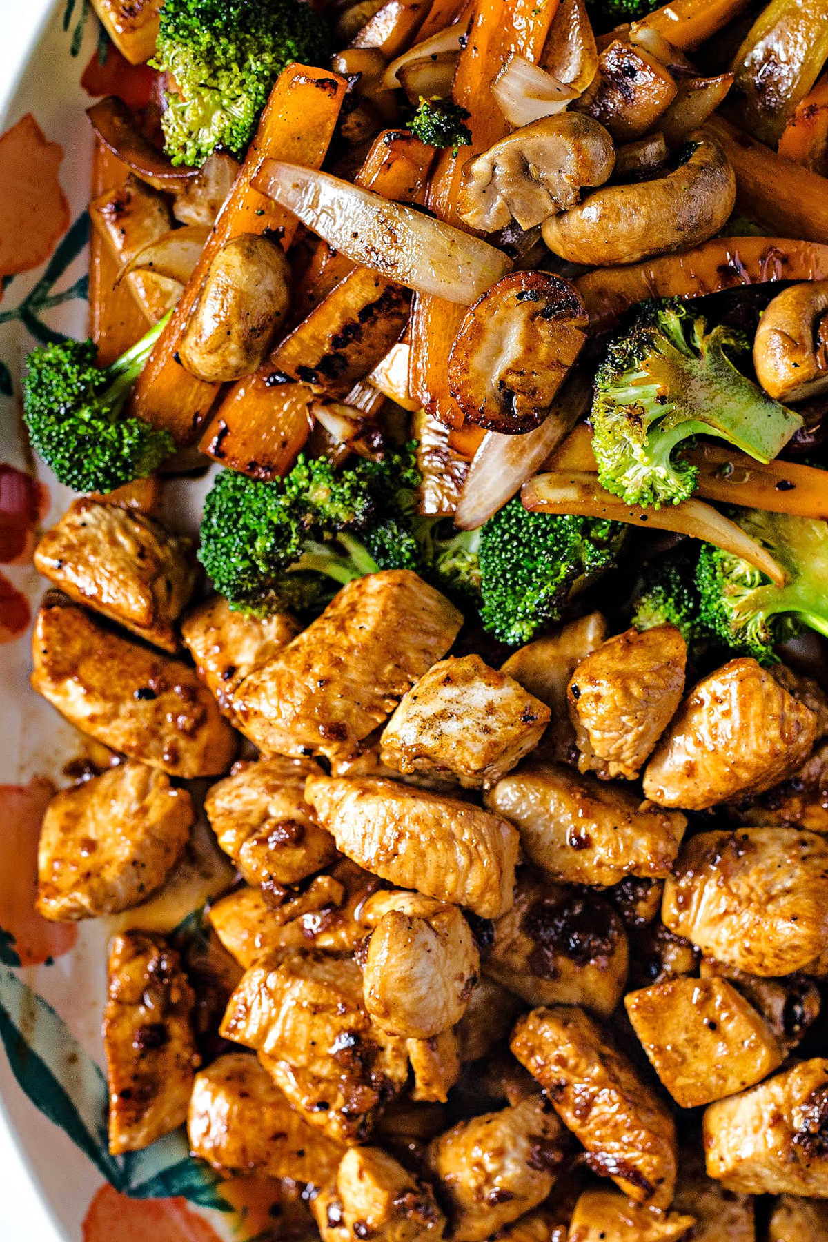 close up shot of hibachi chicken and vegetables on a platter.
