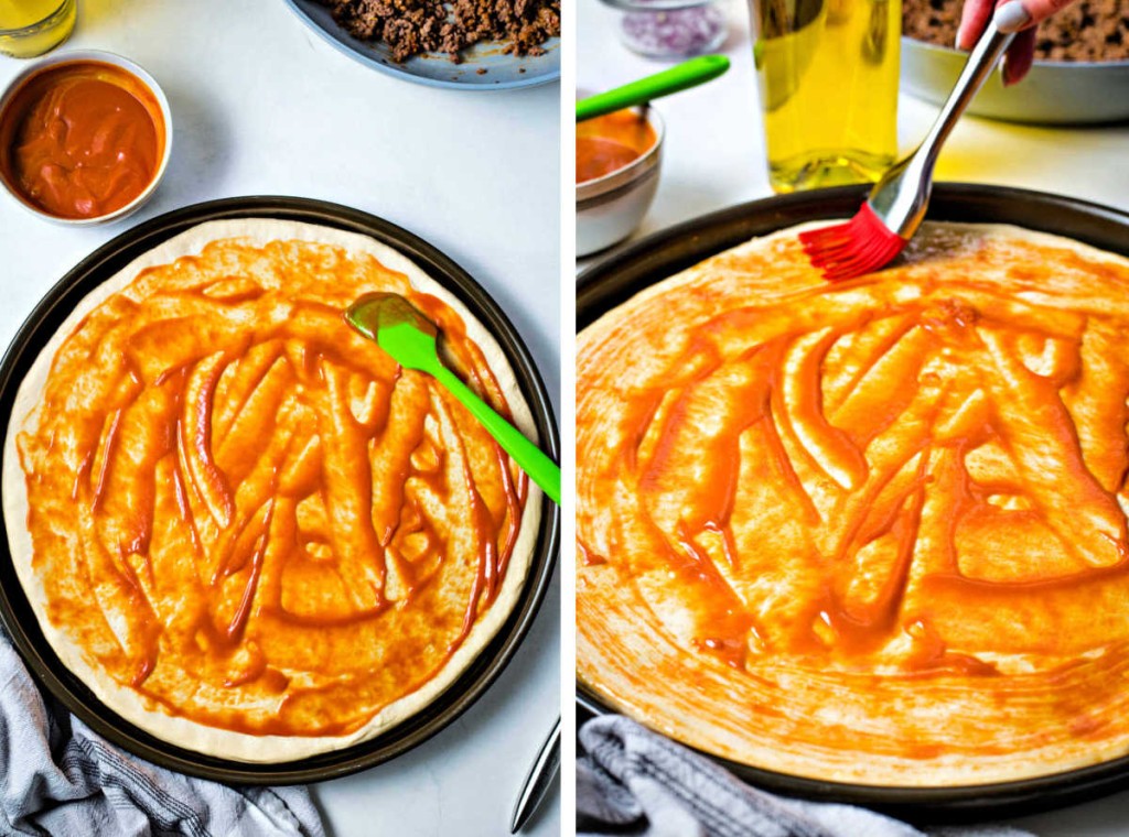 spreading sauce on top of a pizza crust; brushing the edges with olive oil.