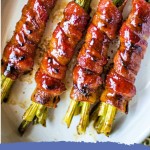 Bacon Wrapped Asparagus in a white serving dish.