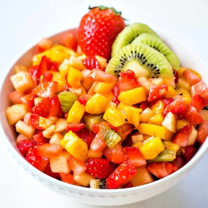 fruit salsa in a white bowl on a table.