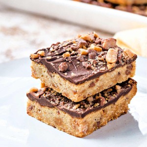 two Heath cookie bars stacked on top of each other on a plate.