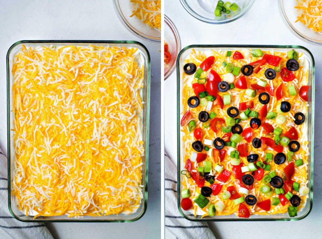 process step: a layer of cheddar cheese and other toppings finishing off layered taco dip.