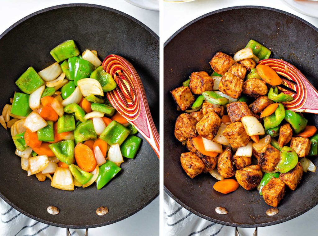 stir frying vegetables in a work; pork and vegetables in a wok for sweet and sour pork.