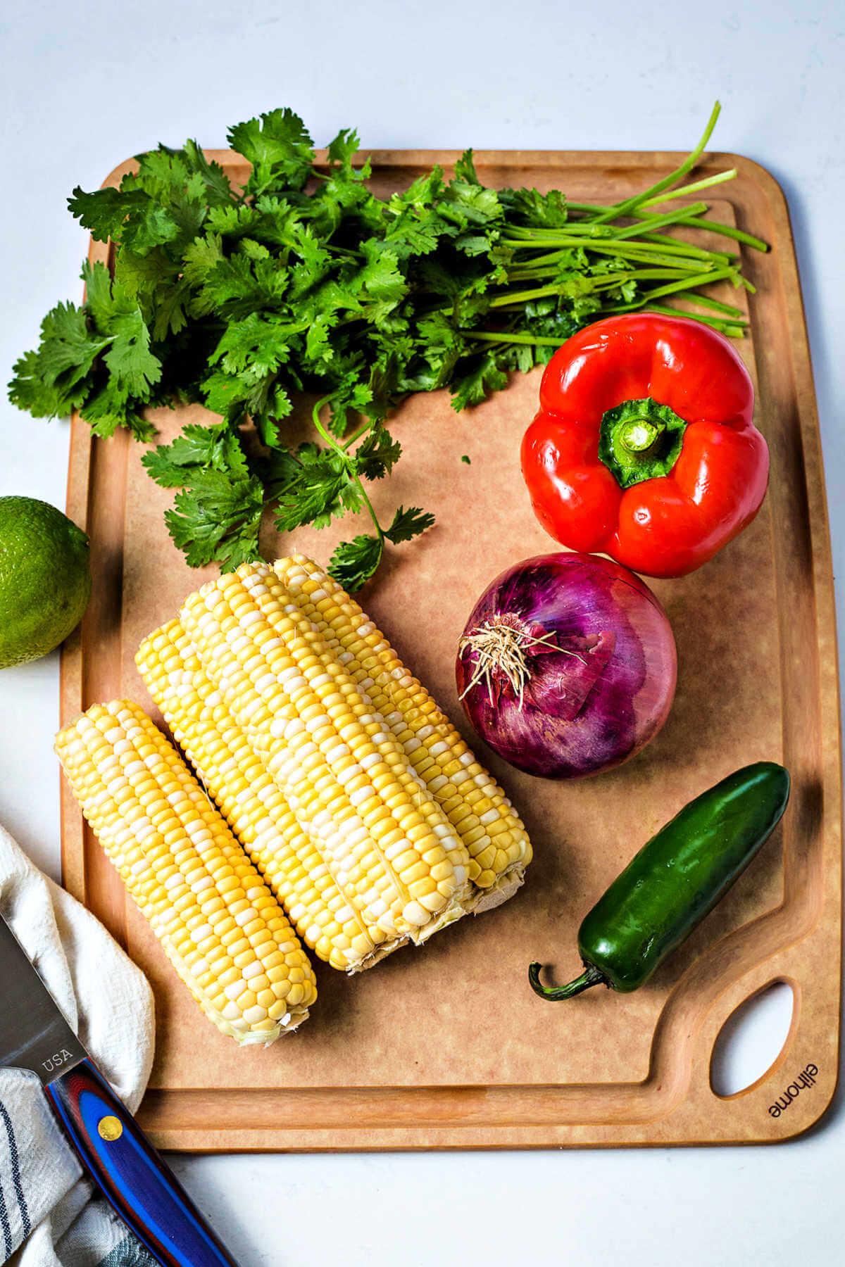 ingredients for corn salsa on a table.