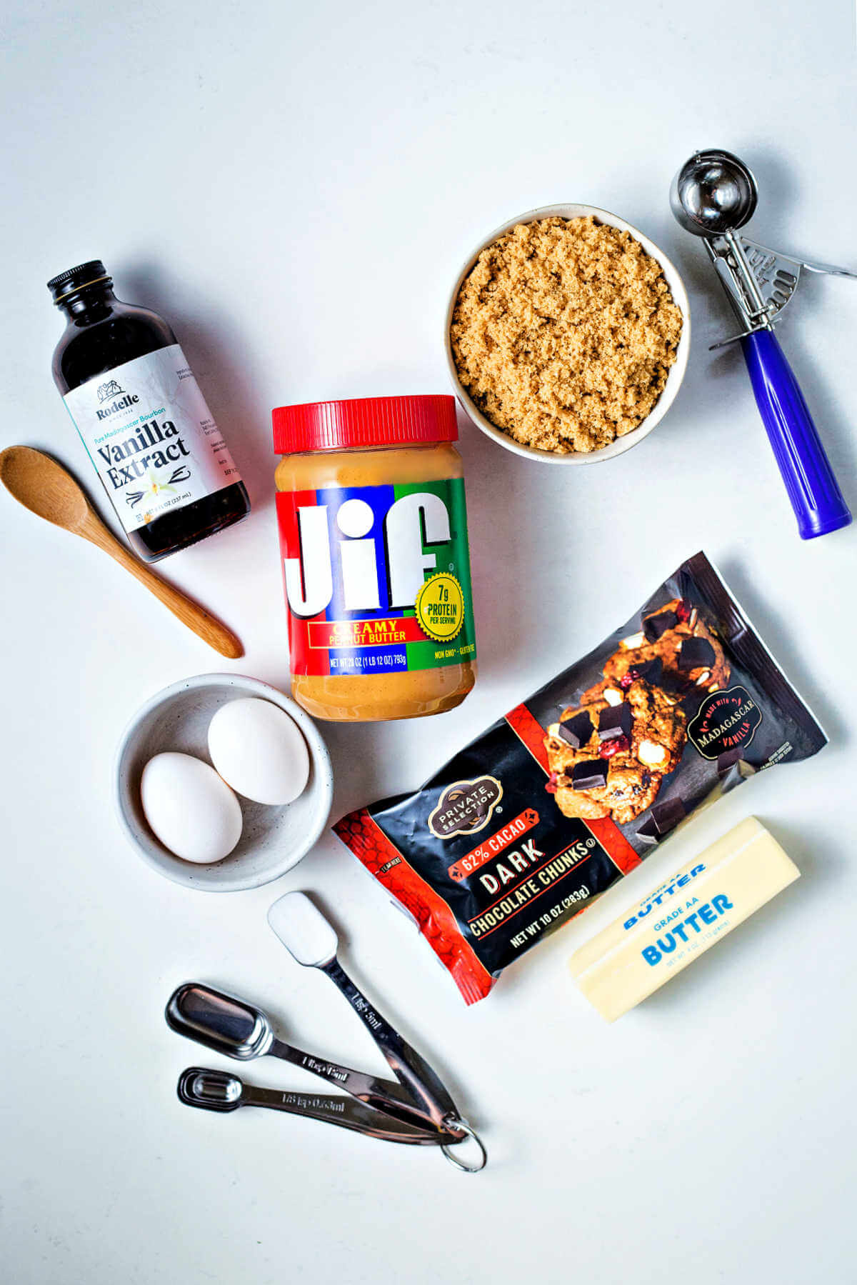 ingredients for flourless peanut butter sandwich cookies on a table.