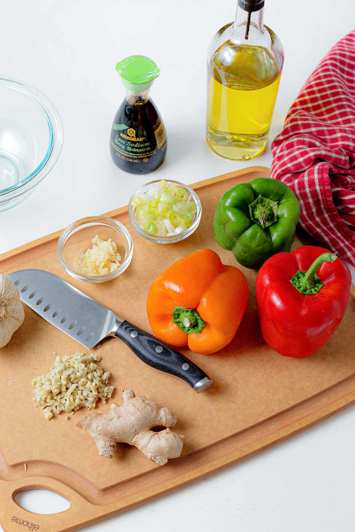 ingredients for pepper steak on a cutting board.