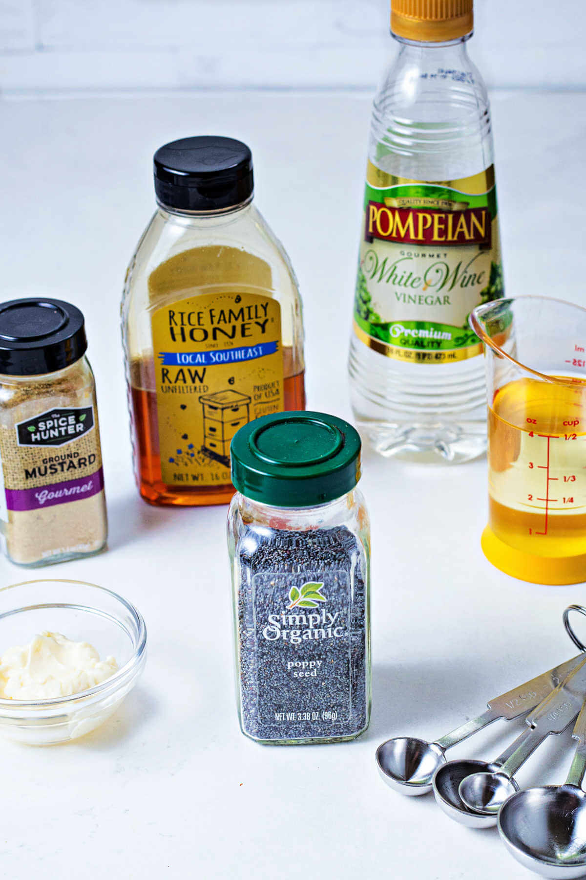 ingredients for poppy seed dressing on a counter.