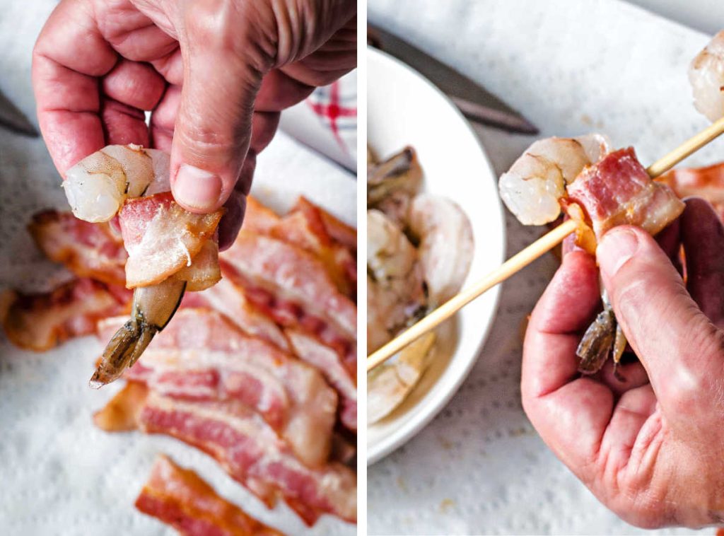 wrapping a raw shrimp in bacon and placing on a bambo skewer.