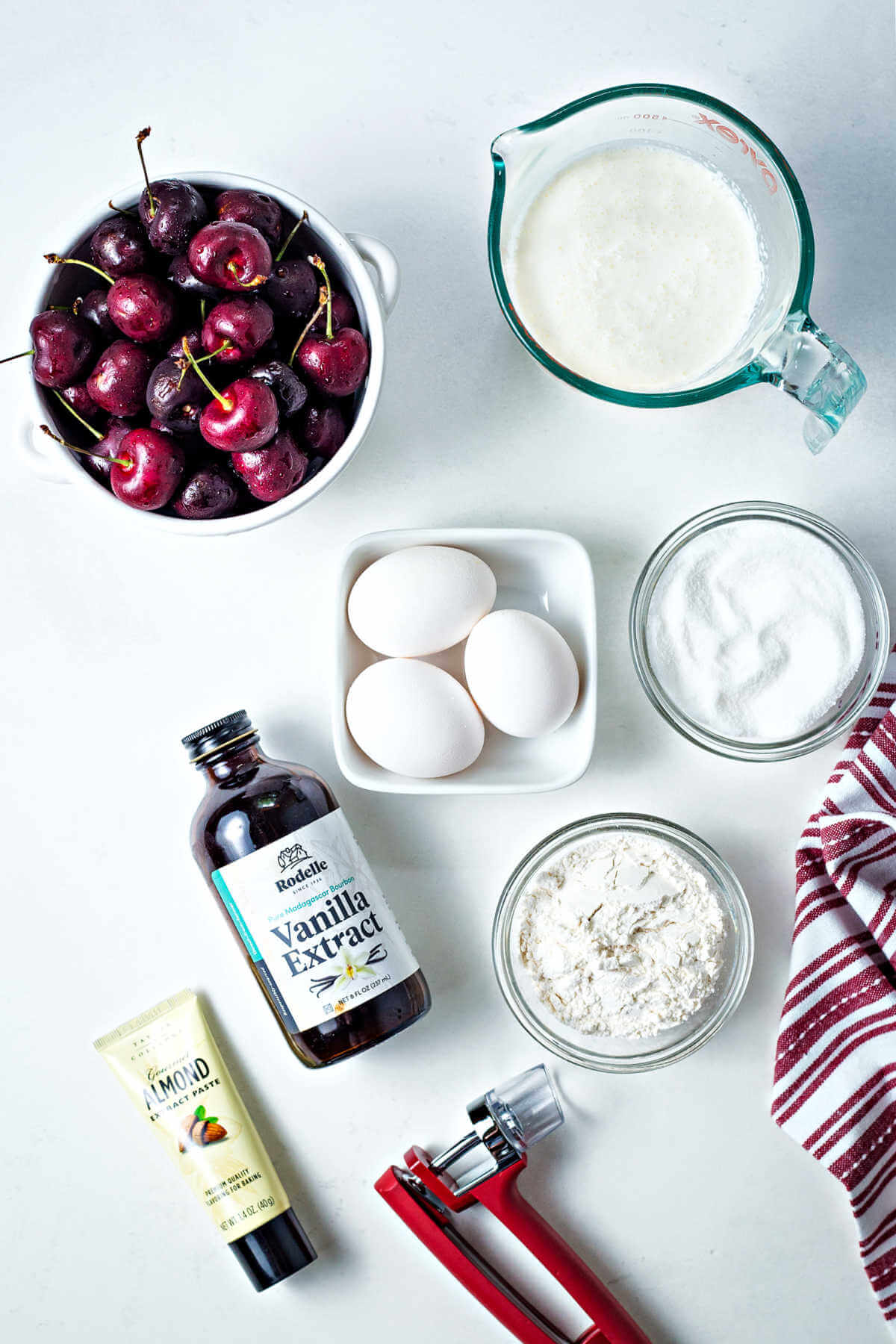 ingredients for cherry clafoutis on a table.