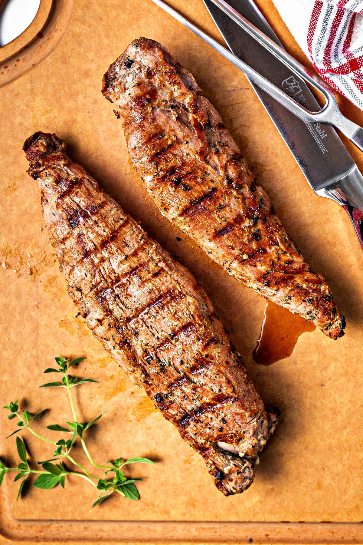 grilled pork tenderloin on a cutting board.