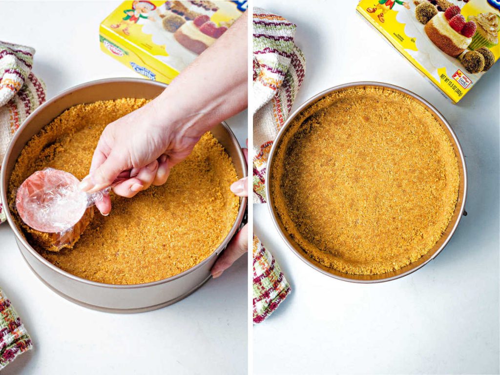 pressing a graham cracker crust into a springform pan with a measuring cup.