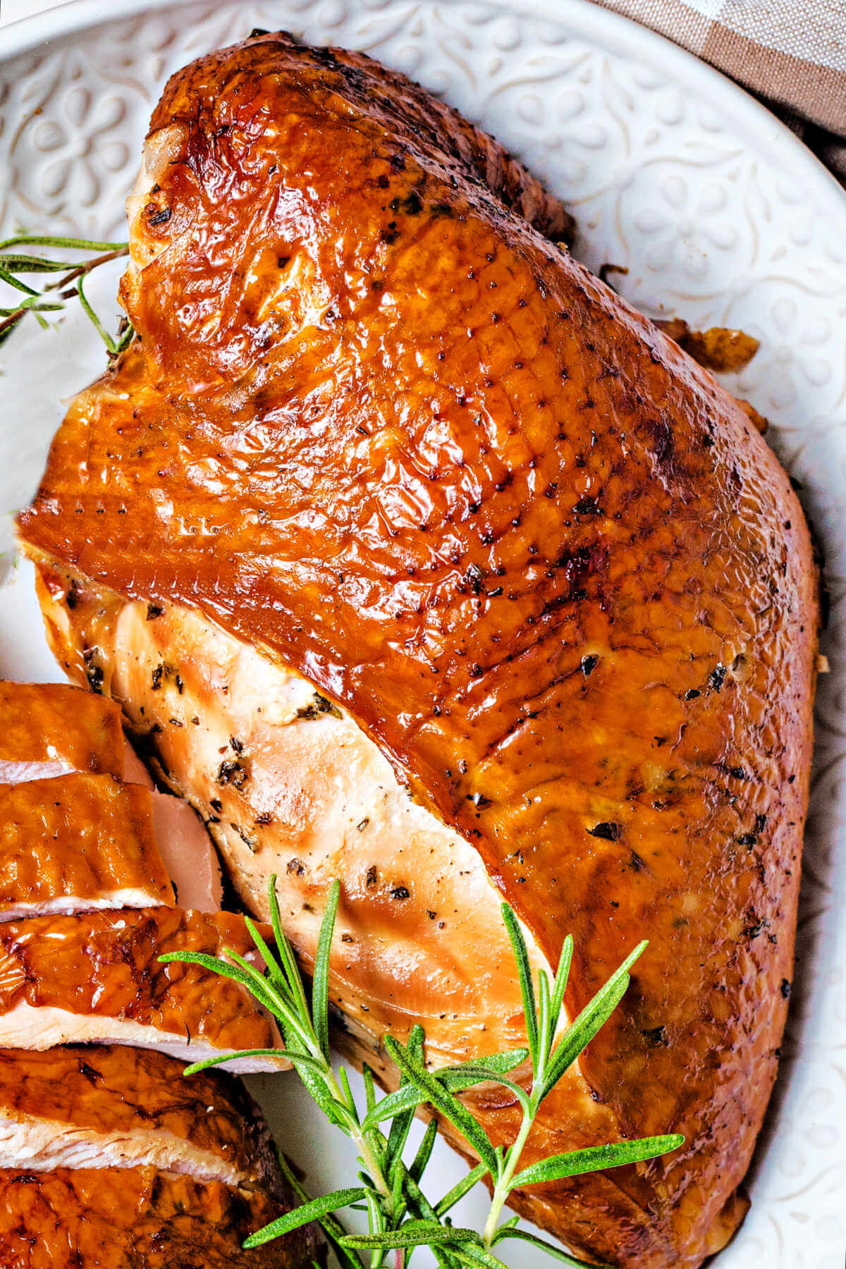 a platter of smoked turkey breast.