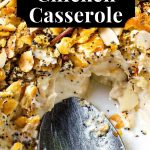 Poppy Seed Chicken Casserole with a serving spoon.