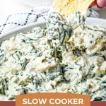 Slow Cooker Spinach Artichoke Dip with chips in the background.