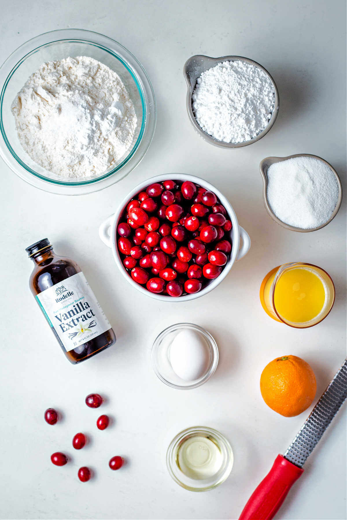 ingredients for cranberry orange bread on a table.