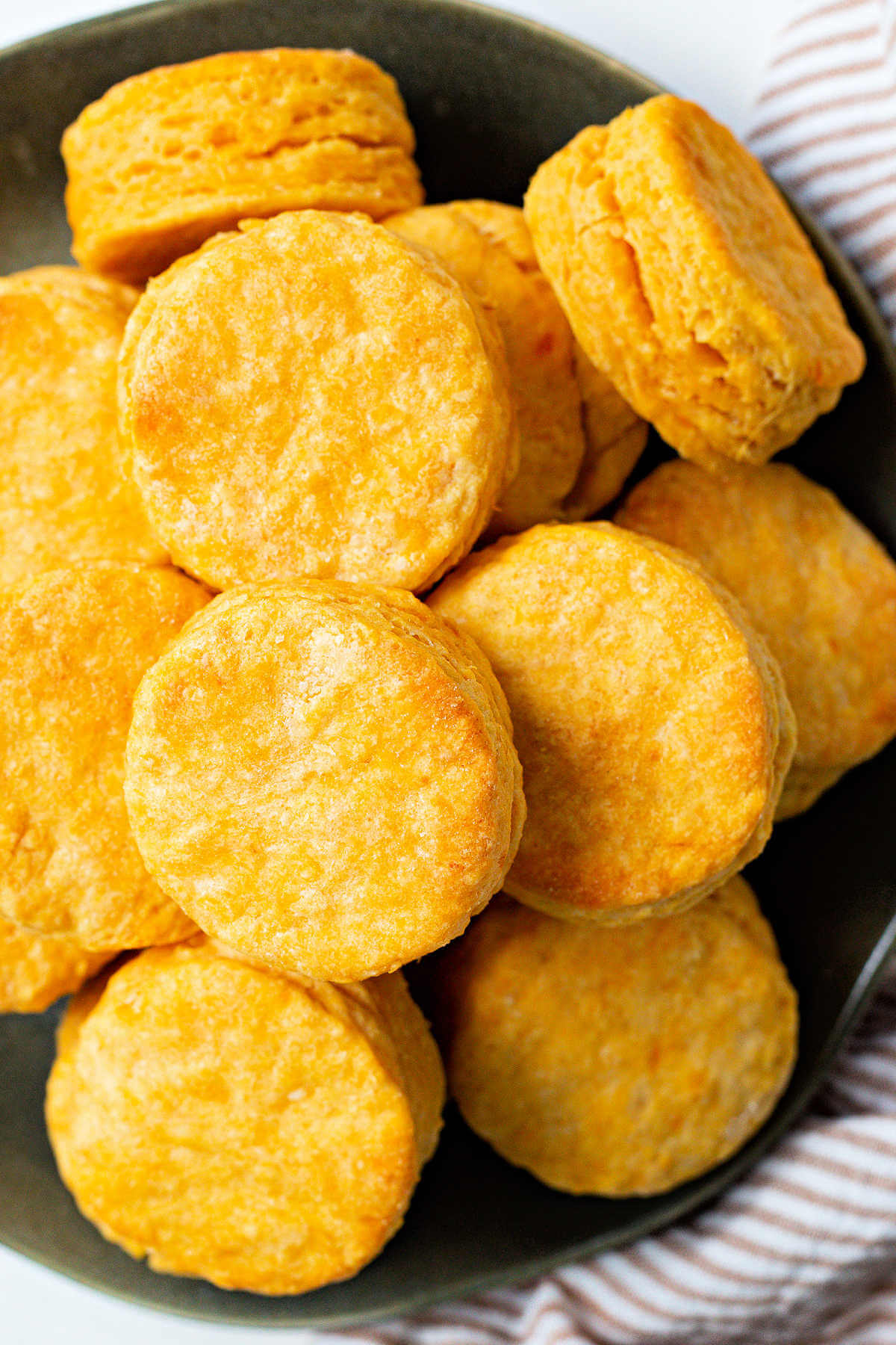 a plate piled high with sweet potato biscuits.