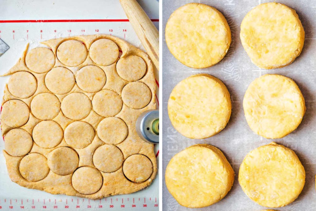 dough rolled out and cut with a biscuit cutter; sweet potato biscuits on a baking sheet ready for the oven.