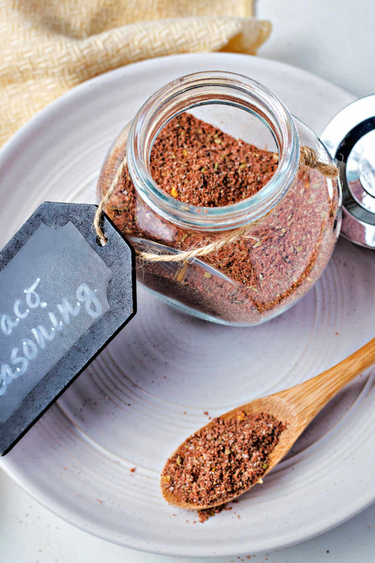 taco seasoning in a glass jar with a label attached.