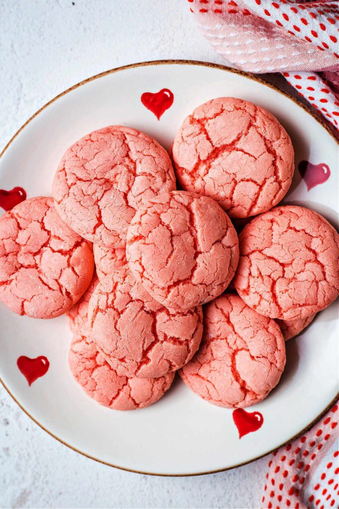 3-ingredient strawberry cake mix cookies on a valentine plate on a table.