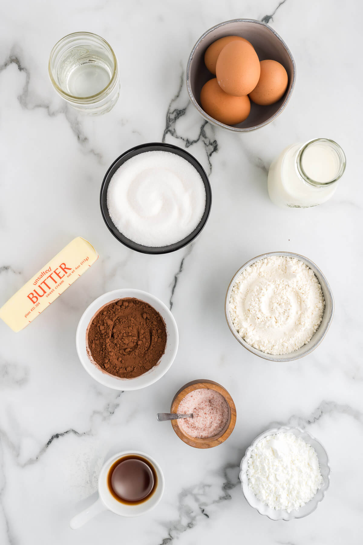 ingredients for chocolate cream puffs on a table.