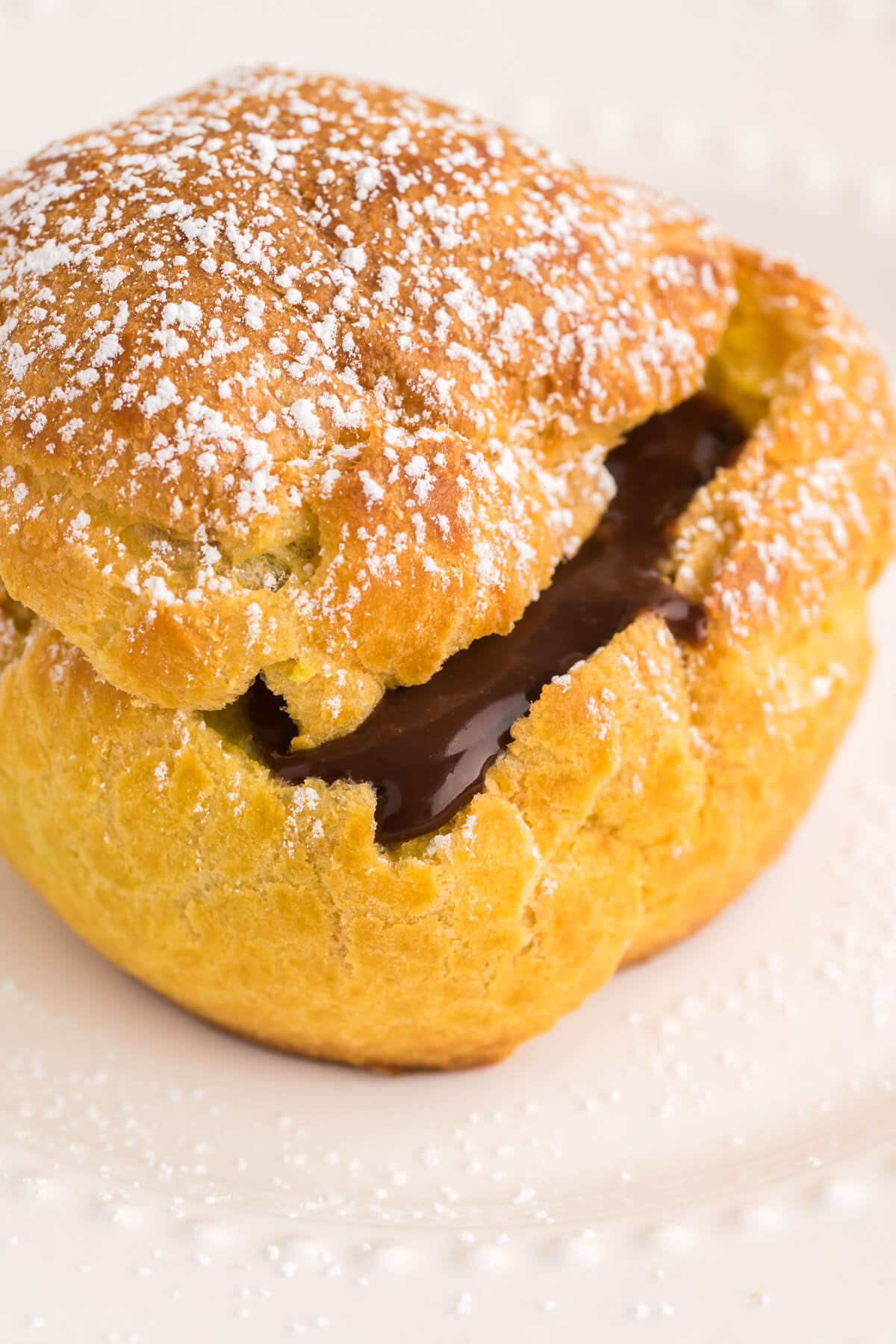 a cream puff filled with chocolate custard.