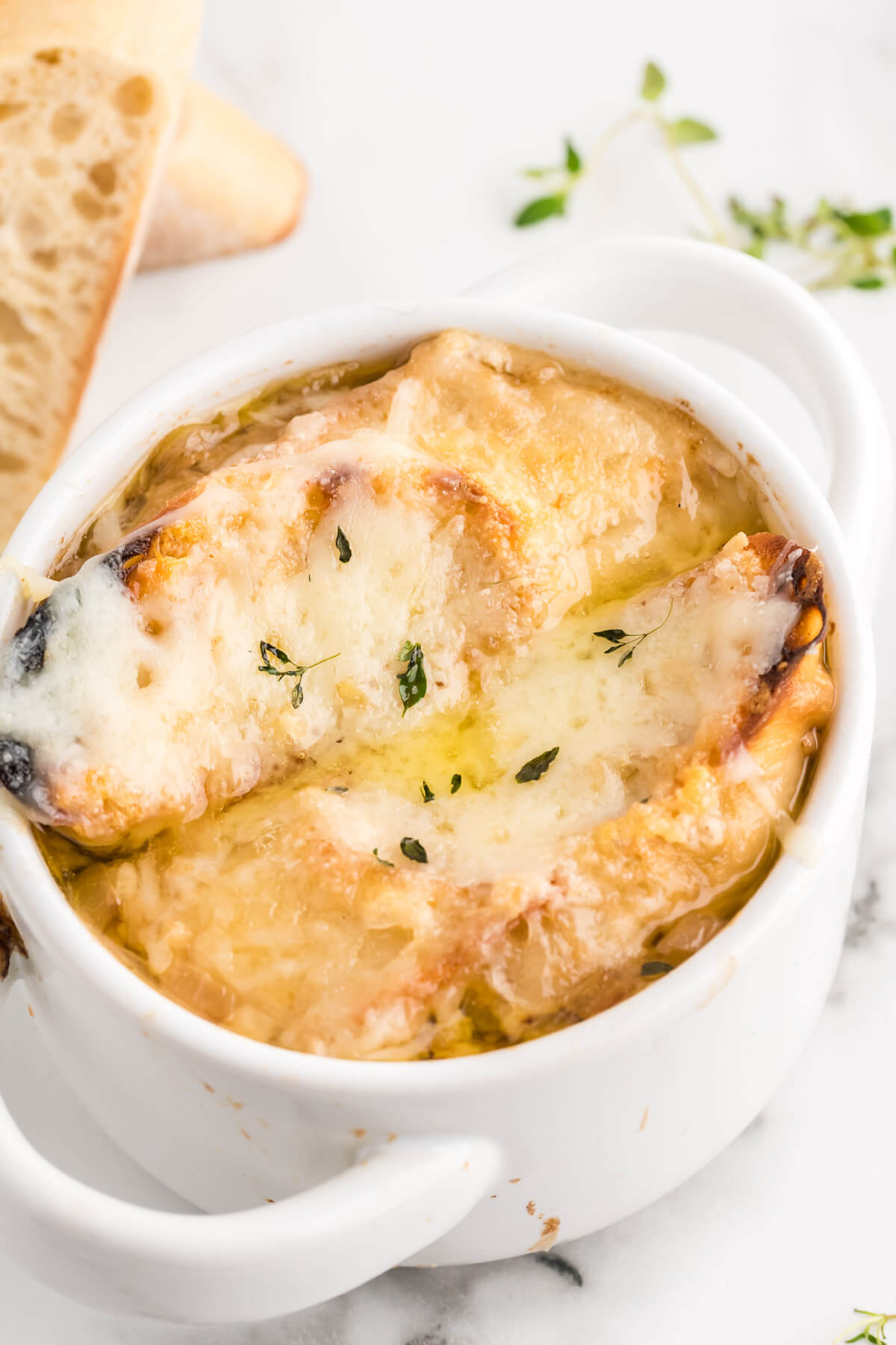 French onion soup with cheesy croutons on top.