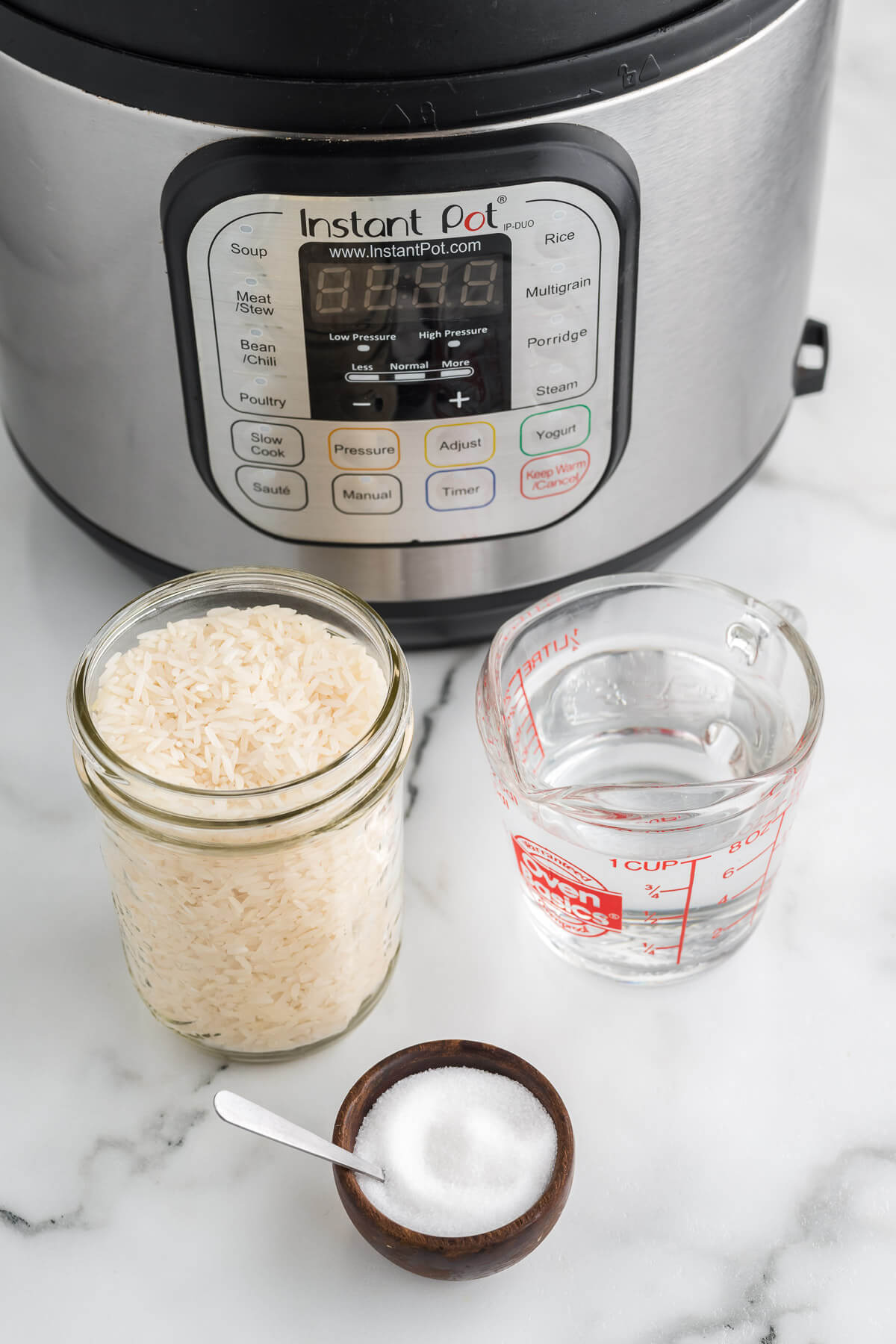 ingredients for instant pot rice on a kitchen counter.