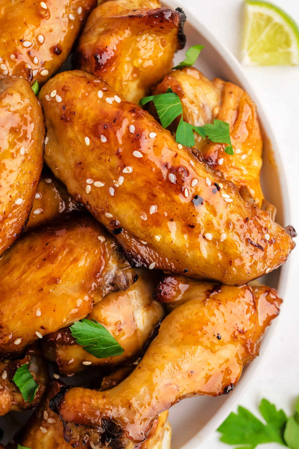 close up image of sticky baked chicken wings.