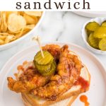 Nashville-Style Hot Chicken Sandwich on a plate with pickles.
