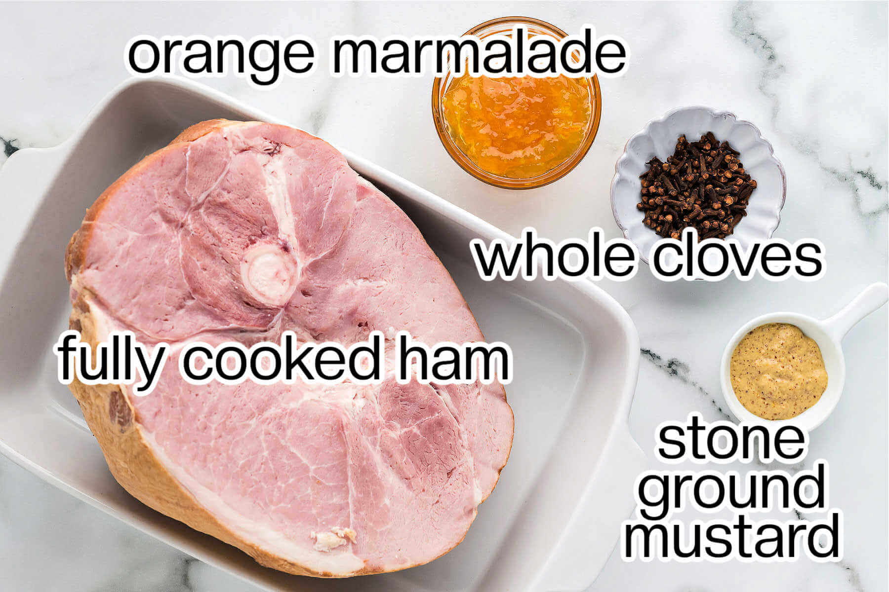 ingredients for making glazed ham on a table.