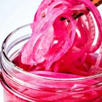 Pickled Red Onions in a mason jar.