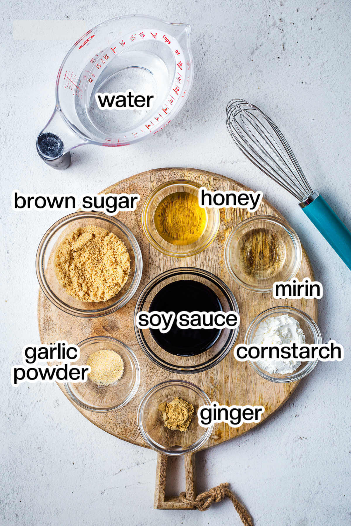 Ingredients for homemade teriyaki sauce on a table.