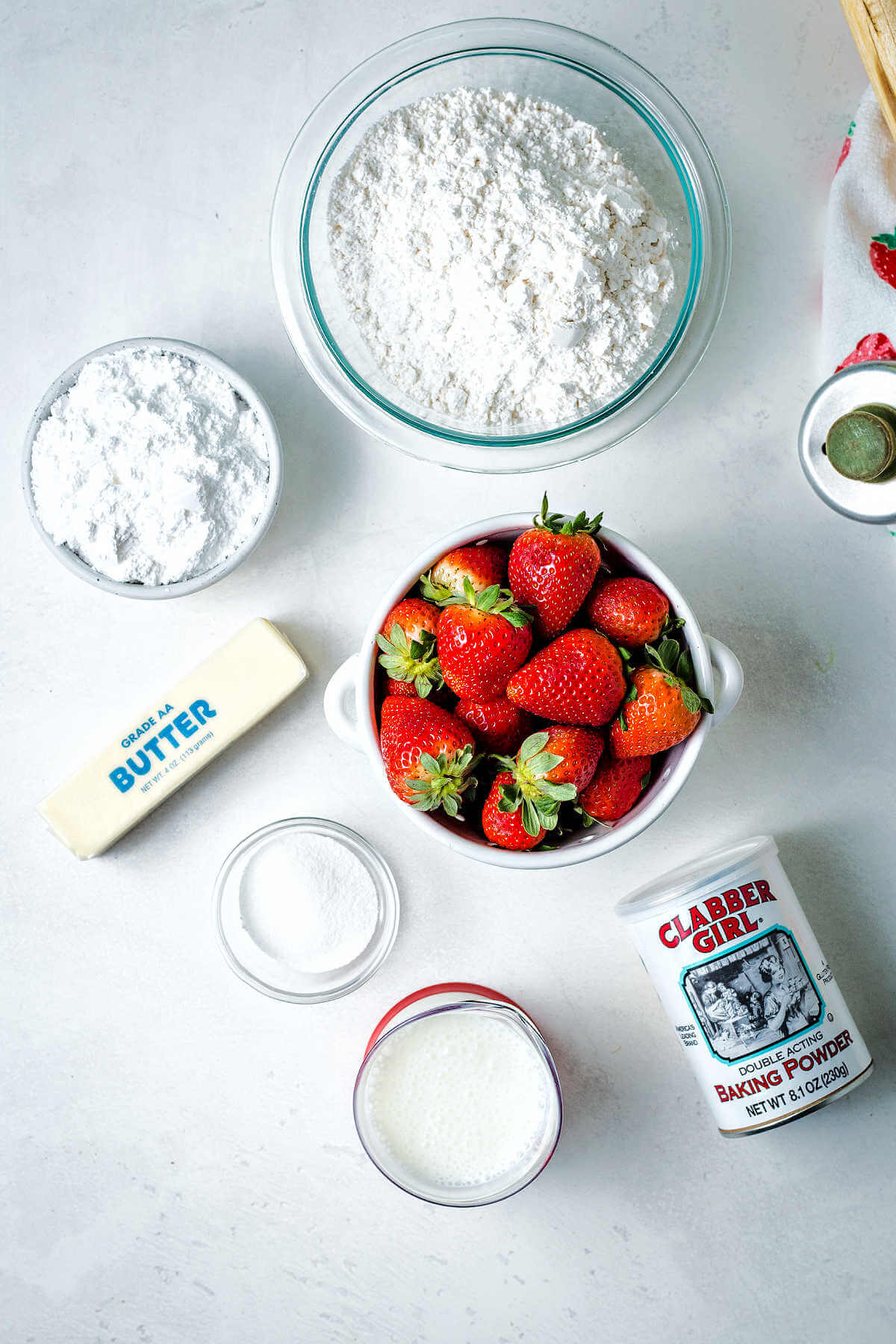 ingredients for strawberry biscuits on a table.