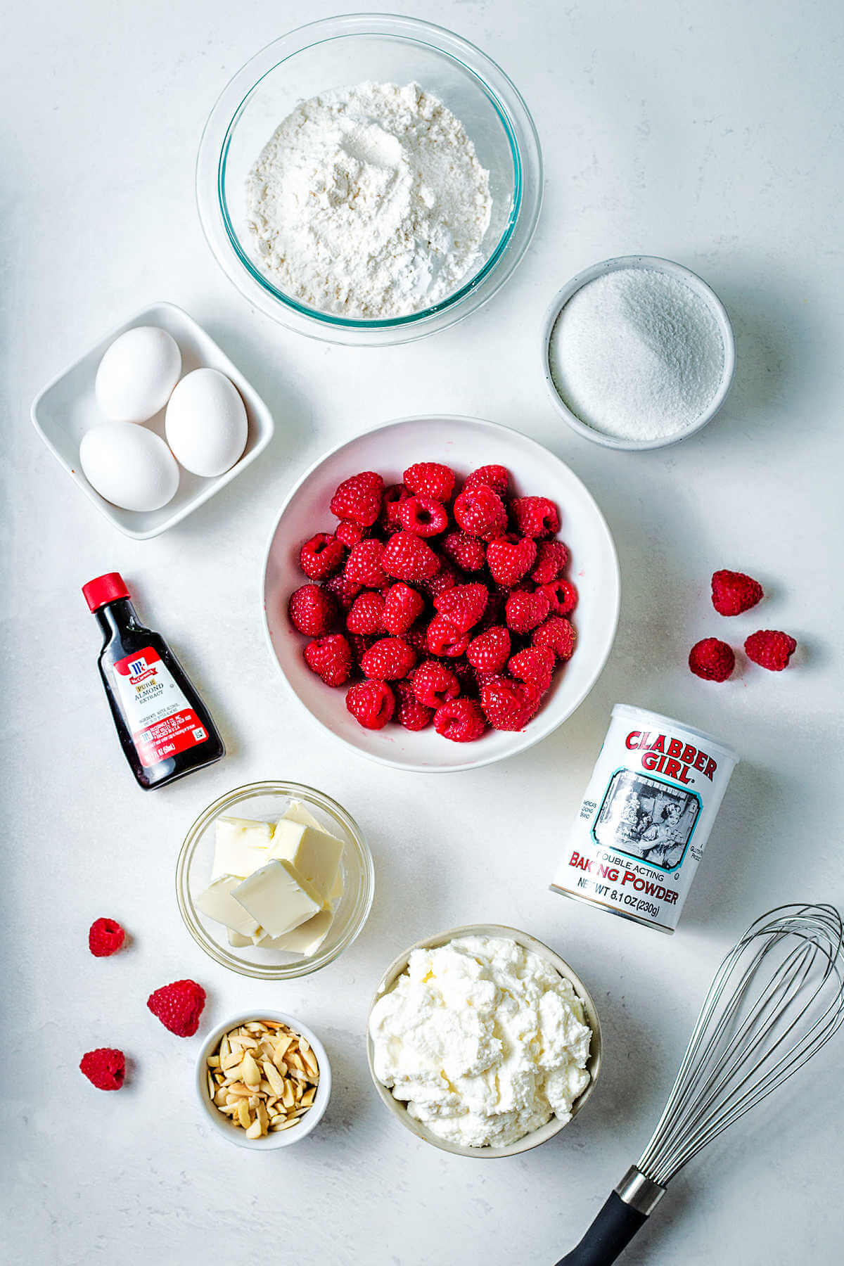 ingredients for raspberry ricotta cake on a table.