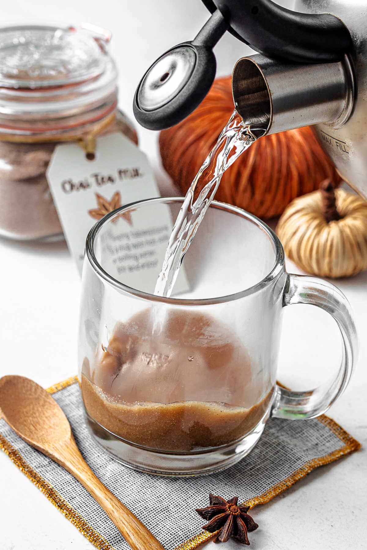 pouring boiling water into a cut with chai latte tea mix.