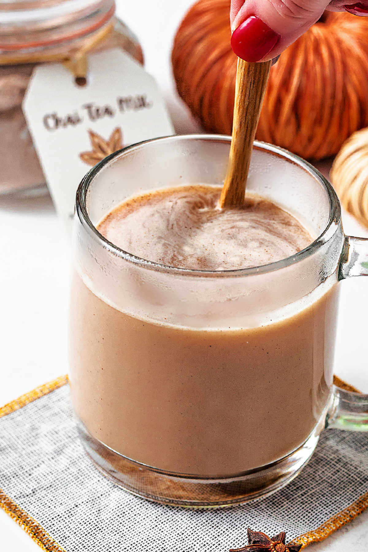 stirring water and tea mix together to make an instant chai tea.