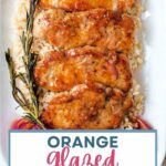 ORANGE MUSTARD GLAZED PORK CHOPS ON A SERVING PLATE.