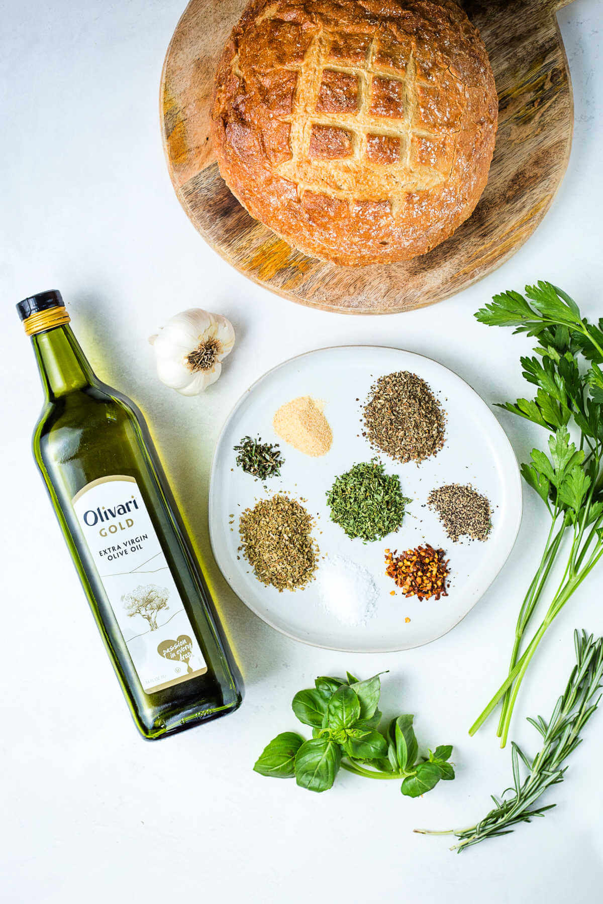 ingredients for olive oil bread dip on a table.
