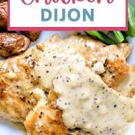 Chicken Dijon with gravy on a plate.