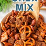 HOMEMADE CHEX MIX IN A BOWL ON A TABLE.